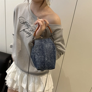 Retro denim doctor bag with pearl pattern, wooden handle and metal chain strap