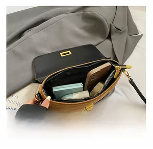 Detail view of the interior capacity showing a zippered pocket and daily essentials