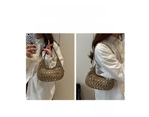 Detail of coffee hobo bag with silver studs shown in handheld and shoulder carry styles