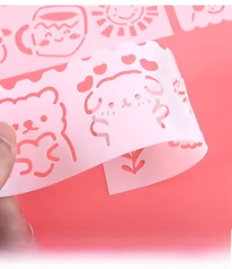 Macro view of flexible pink PP drawing stencil with cute hollowed animal patterns