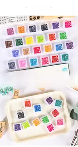 Close-up of 24-color ink pad set for kids DIY finger painting with vibrant sponge pads