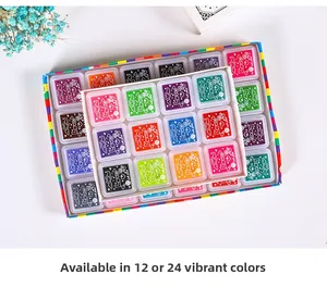 Close-up of 24-color DIY finger paint ink pads in a rainbow gift box arrangement