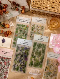 Macro shot of nature series floral PET stickers including roses and lavender for scrapbooking