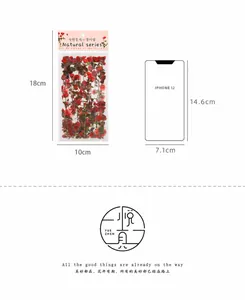 Size comparison of 10x18cm red rose stickers pack with iPhone 12 on white background