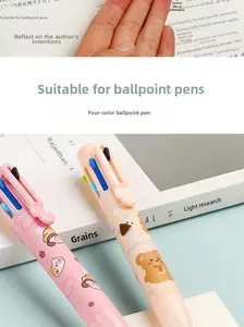 Close-up of four-color retractable ballpoint pen with cute cartoon bear and strawberry patterns