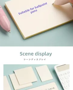 Detail of translucent beige sticky notes showing smooth writing with a pink ballpoint pen