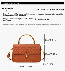 Detail showing orange quilted PU leather handbag dimensions with bamboo handle and strap