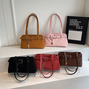 Retro biker style shoulder bags in multiple colors with belt buckle and key charm