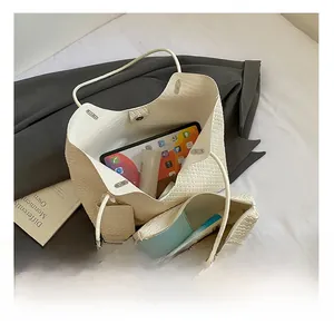 Detail view of woven tote bag set showing large interior capacity for daily essentials