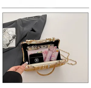 Top view of gold sequin evening bag showing interior capacity for essentials