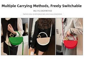 Detailed view of three half-moon handbags in green, beige and red with gold metal handles