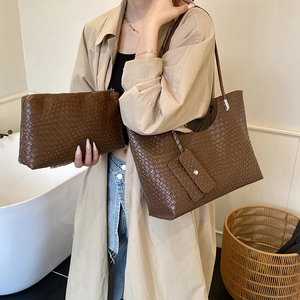 Brown woven leather tote bag set including a large shoulder bag and matching pouch