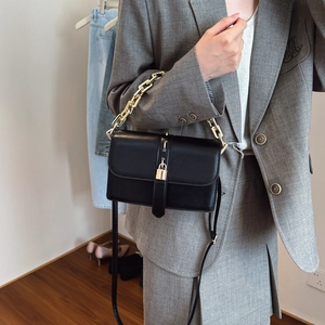Chic black leather crossbody flap bag with gold chain strap and padlock detail for women