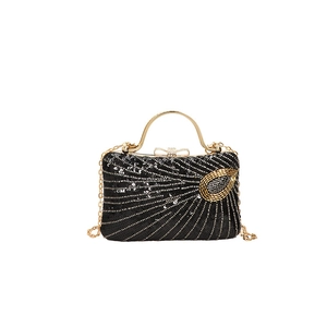 Elegant black sequin evening clutch bag with gold peacock embroidery and metal handle