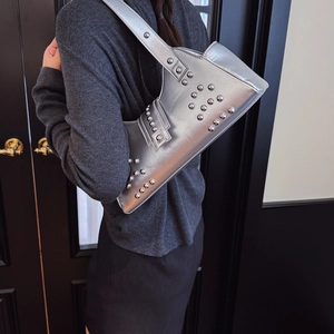 Metallic silver punk style underarm bag with silver studs on shoulder strap