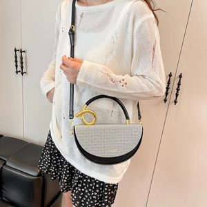 Fashionable grey woven saddle bag with gold metal handle and adjustable strap for women