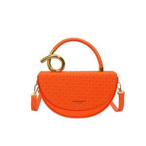 Orange half-moon crossbody bag with woven flap and golden metal knot handle accent