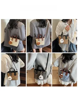 Lifestyle view of mini tote bags in contrast colors with cute plush doll pendant