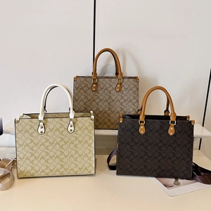 Three elegant vintage printed tote bags in beige, brown, and dark coffee with gold hardware