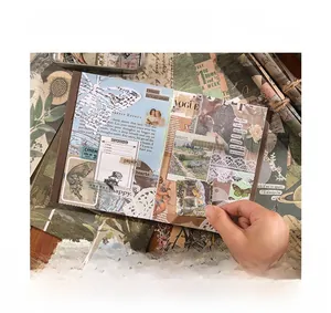 Detail of vintage scrapbook stickers featuring butterflies and artistic portraits