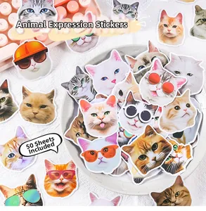Close-up of 50 unique waterproof cartoon cat stickers in a dish with a keyboard backdrop