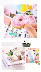 Macro shot of self-adhesive cartoon panda and cat stickers with a waterproof coating layer