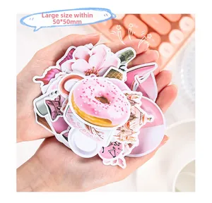 Detailed view of large pink aesthetic stickers with cherry blossoms and sweet donuts