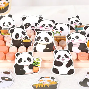 Cute panda cartoon stickers with various poses displayed on a pink mechanical keyboard