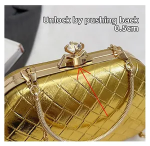 Close-up of gold woven evening bag showing how to push the diamond ring clasp 0.5cm back