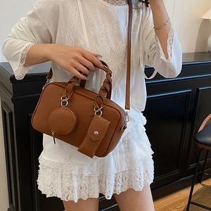 Brown litchi leather Boston bag with woven handles and small hanging pouch set
