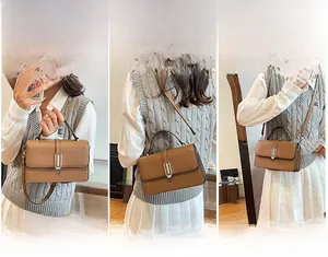 Brown vintage handbag showing versatile styles of carrying as a tote, shoulder, and crossbody bag
