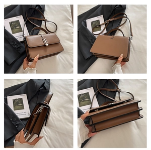 Detail view of brown PU leather shoulder bag showing silver clasp and compartments