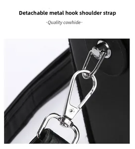 Detail of quality cowhide bag featuring a detachable metal hook and silver shoulder strap