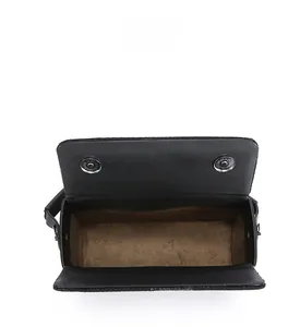 Interior view of black crossbody bag showing large capacity and soft brown suede lining