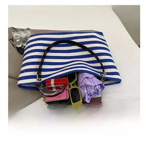 Top view of large capacity blue striped canvas tote bag showing spacious interior with items