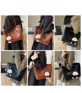 Detailed views of the large capacity tote bag shown from multiple angles with a charm
