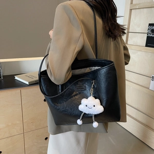 Black PU leather tote bag with white cloud plush charm, casual shoulder bag style
