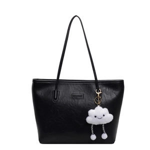 Retro black leather tote bag with large capacity and cute cloud charm on white background