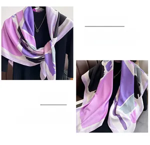Detail of artistic abstract color block silk scarf with premium hand-rolled hem edges