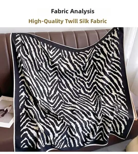 Close-up of premium twill silk fabric featuring classic black and white zebra pattern