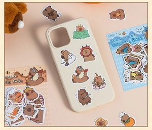 Close-up of 40PCS cute Capybara stickers in various costumes for DIY scrapbooking
