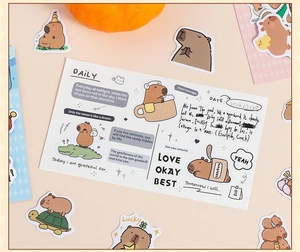Detailed close-up of cute Capybara scrapbooking stickers and decorative journal cards