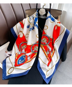 Close-up of nautical silk scarf featuring anchors and ropes on a professional mannequin