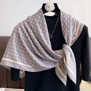 Elegant polka dot silk scarf in light grey and pink with a sleek satin finish