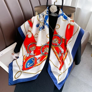 Silk-textured nautical scarf featuring anchors and ropes in bold red, blue and gold colors