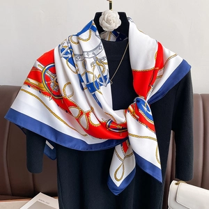 Detail of nautical square scarf with anchor and helm patterns in navy blue and red