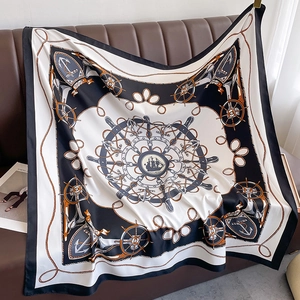 Detail of nautical silk scarf featuring vintage ship, anchors, and helm print designs
