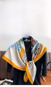 Detail of silk scarf with geometric patterns and horse motifs on a mannequin