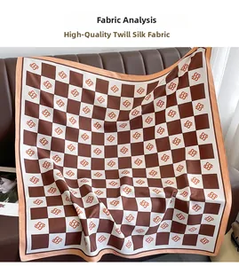 Close-up of premium silk twill scarf featuring a brown and cream checkerboard pattern