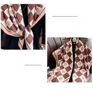 Macro detail of brown and beige checkered silk scarf with premium hemmed edges